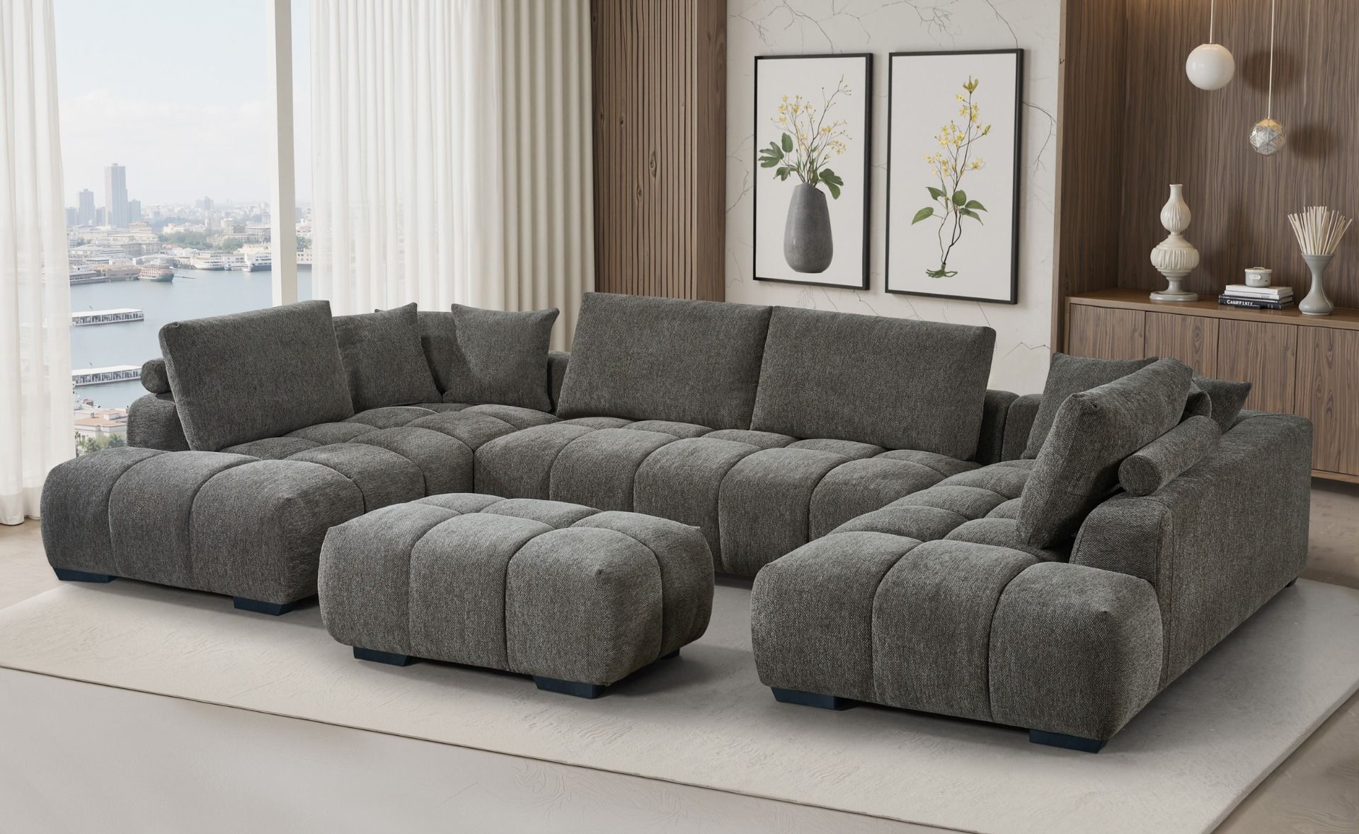 Harmaa jättikokoinen U-kulmasohva muhkealla pyöreällä muodolla