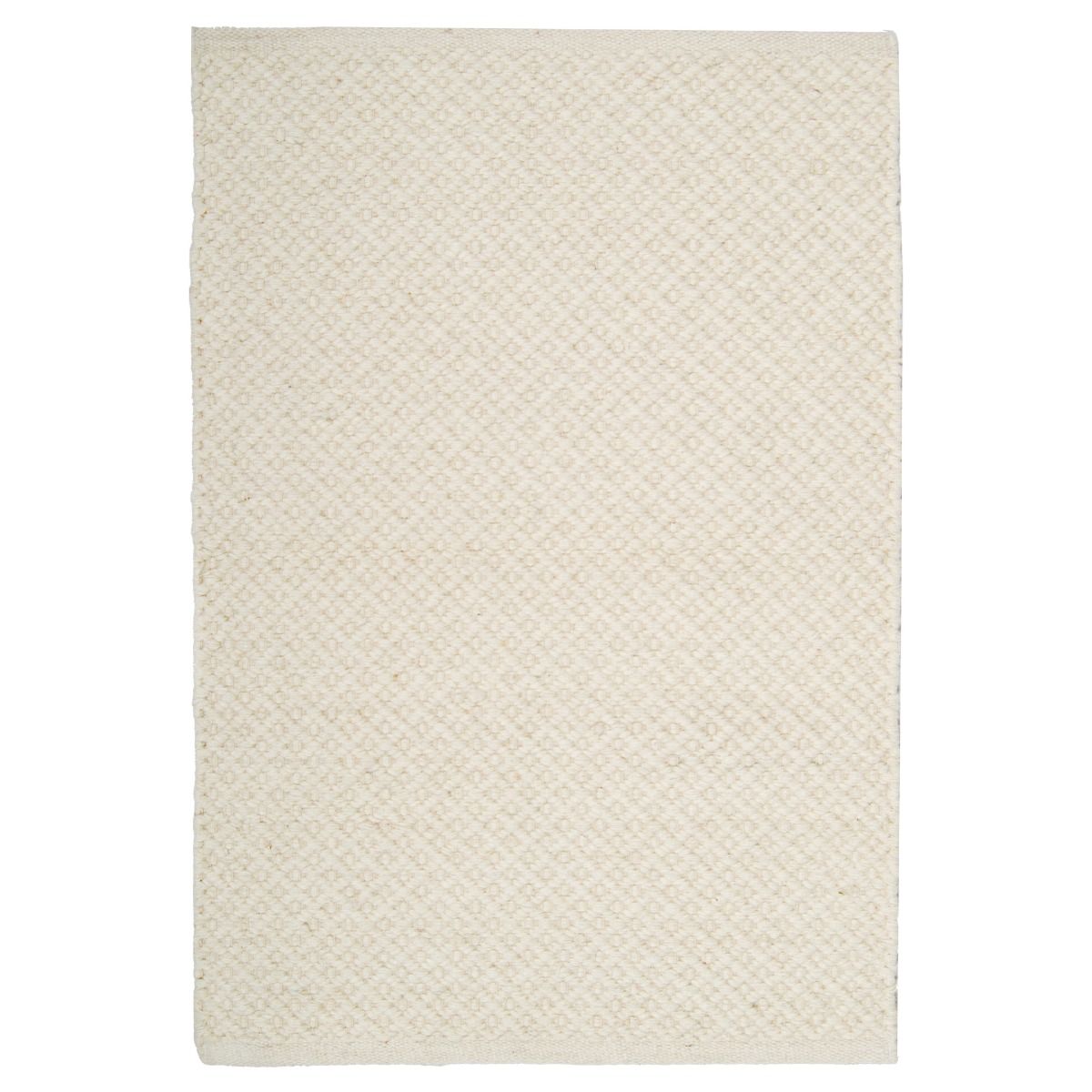 Elvi luonnonvalkoinen villamatto kohokuviolla.