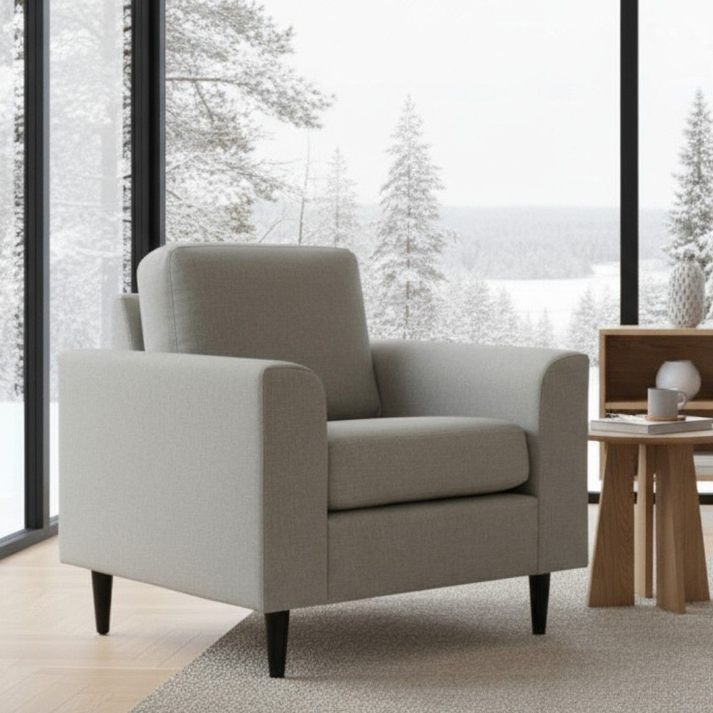 Beige nojatuoli, jossa on mustat puujalat