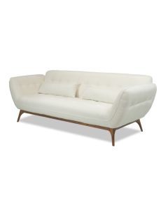 Valkoinen sohva, jossa on puiset jalat