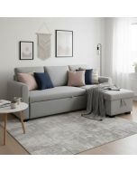 Vaaleanharmaa vuodedivaanisohva olohuoneessa